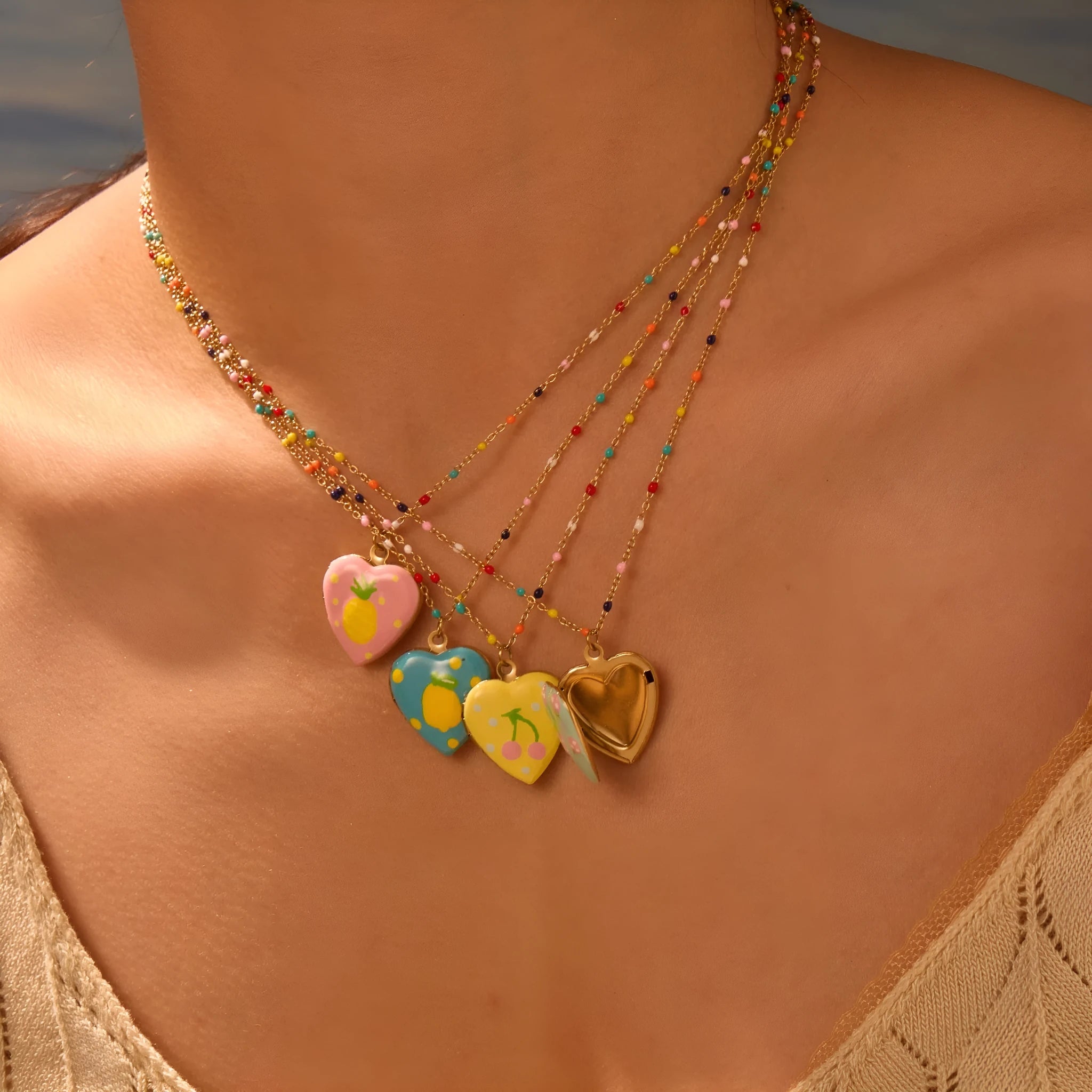 Gold-plated stainless steel necklace with fruit-shaped pendant on adjustable chain