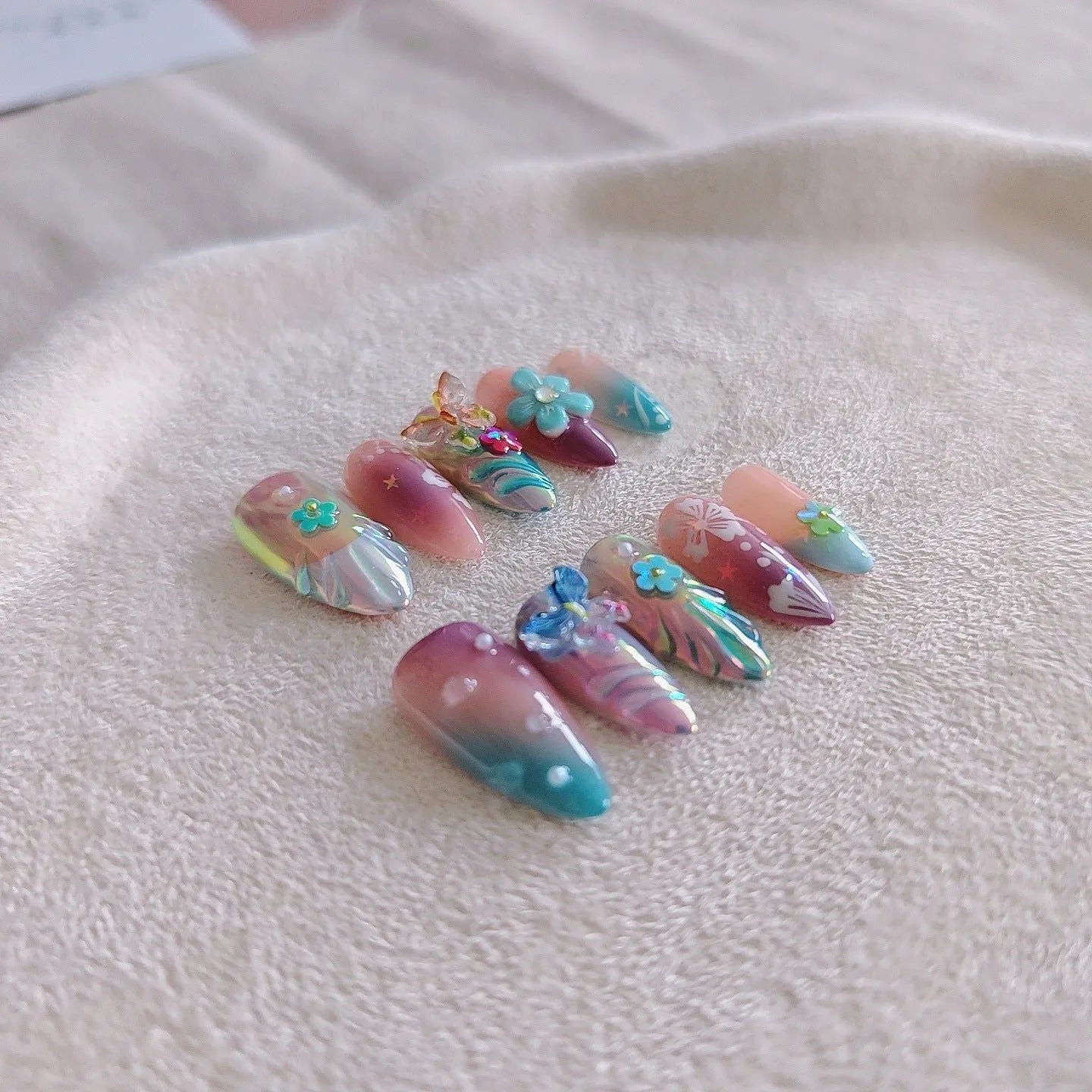 Handmade small flower and butterfly nail art sculptures for three-dimensional manicures