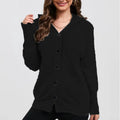 Women's solid colour hooded cardigan sweater in thick cotton fabric showing loose fit and regular sleeves