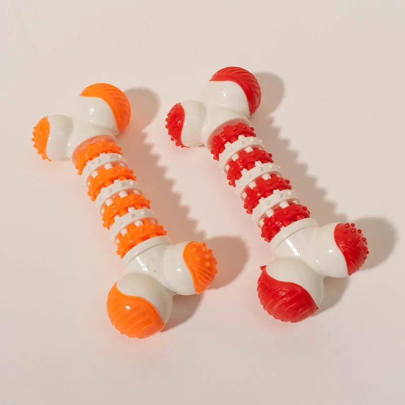 Blue bone-shaped rubber dog toy with a treat holder in the centre, shown next to dog biscuits.