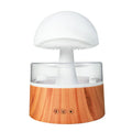 White rain cloud shaped humidifier with falling water droplets and multi-colour lighting