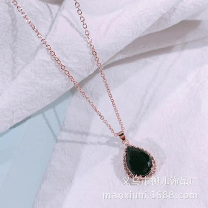 Pink rose gold drop shape rhinestone necklace with geometric design on alloy chain