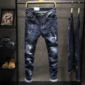 Men's slim-fit skinny jeans in dark blue cotton denim fabric on a hanger.