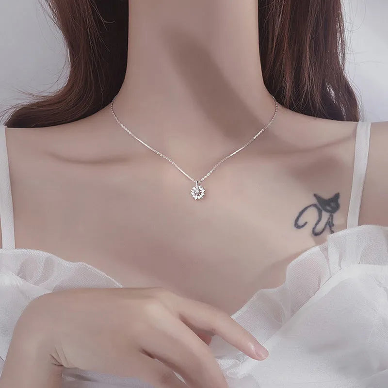 Pure silver rotating snowflake necklace with electroplated finish on adjustable cross chain for women