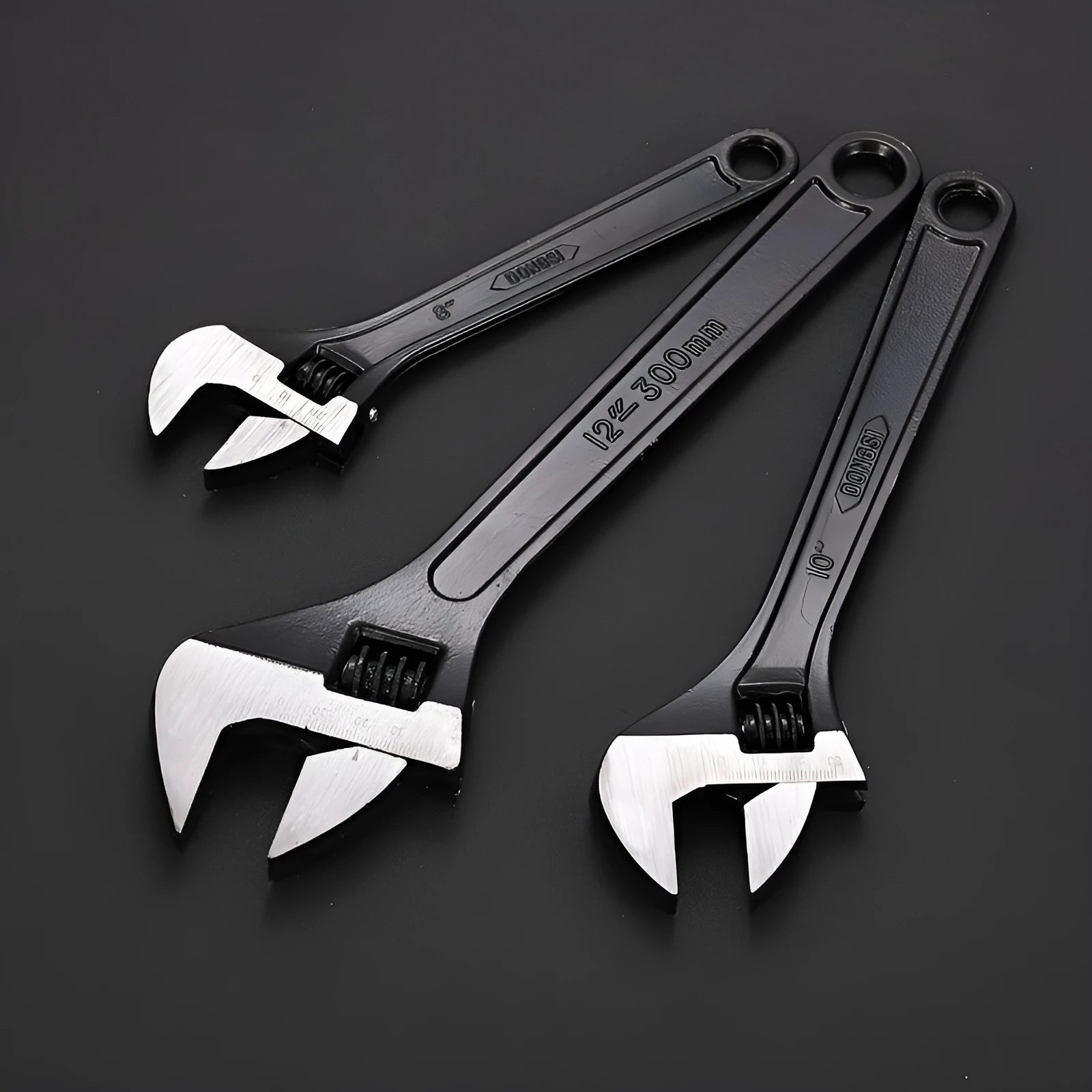 High carbon steel adjustable open-end wrench with blackened finish on a grey background.