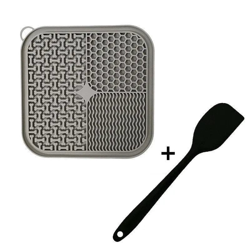 Orange and grey silicone dog licking mat with textured surface and suction cups on back