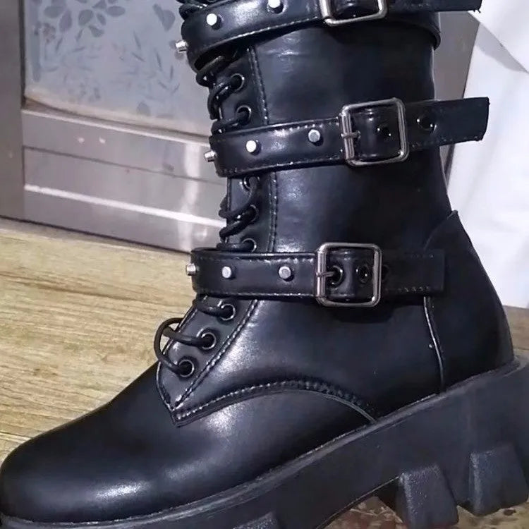 Women's black mid-calf knight boots with metal buckle and side zipper on a white background.