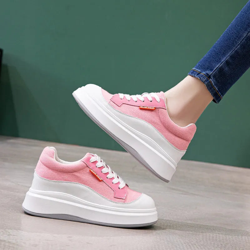 Beige and pink women's leather board shoes with thick soles shown from the side.