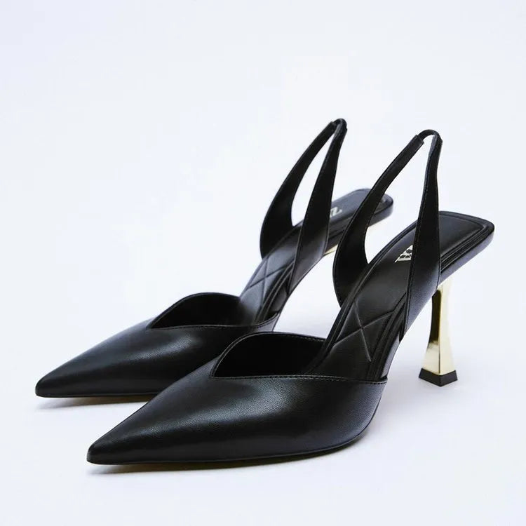 Women's patent leather pointed high heels in apricot and black colours, showing shallow mouth design.