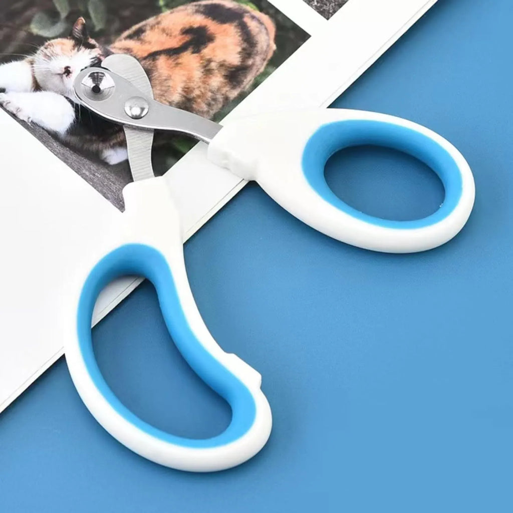 Blue cat nail clippers with a circular guard hole and cushioned non-slip handles on a white background.