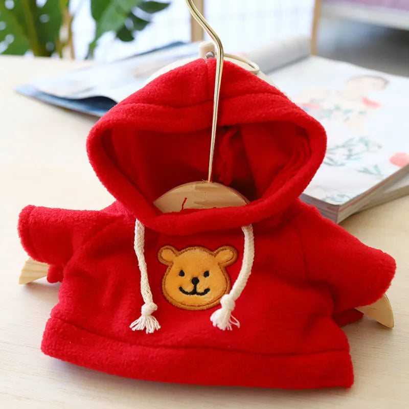 A blue cloth hoodie sweater for a small dog, showing the hood up.
