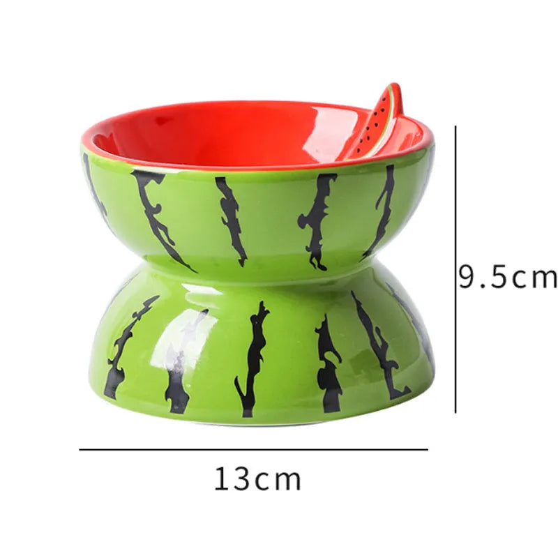 Ceramic raised cat bowl in orange pattern, showing tilted wide-rim design on elevated stand.