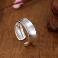 Adjustable opening geometric frosted sterling silver ring with open design