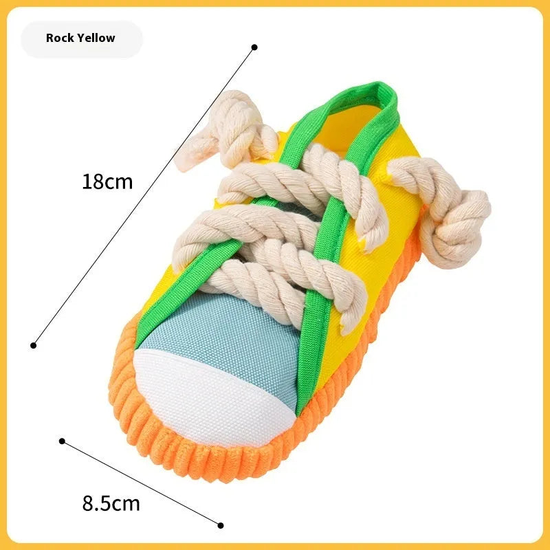 A bendable plastic dog slippers squeaker toy in yellow, black, or blue for chewing and play.
