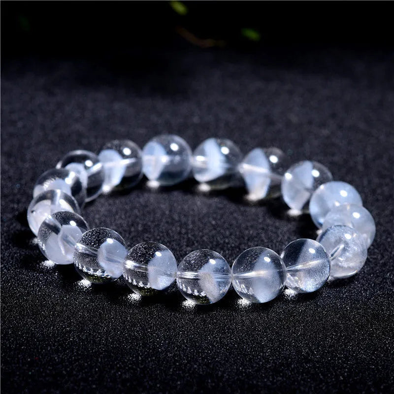 Women's white crystal pyramid bracelet with ghost detail and Ruyi design element