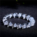 Women's white crystal pyramid bracelet with ghost detail and Ruyi design element