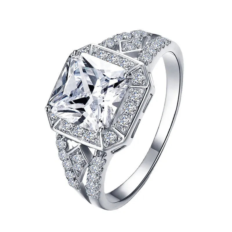 Women's platinum-coloured geometric ring with hollow design and inlaid zircon stones