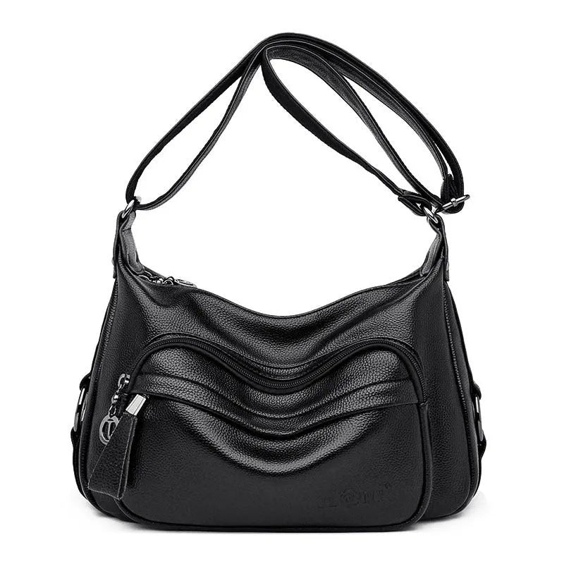 Large blue soft PU women's shoulder bag with a zipper and organised interior compartments.