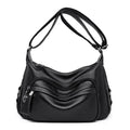 Large blue soft PU women's shoulder bag with a zipper and organised interior compartments.