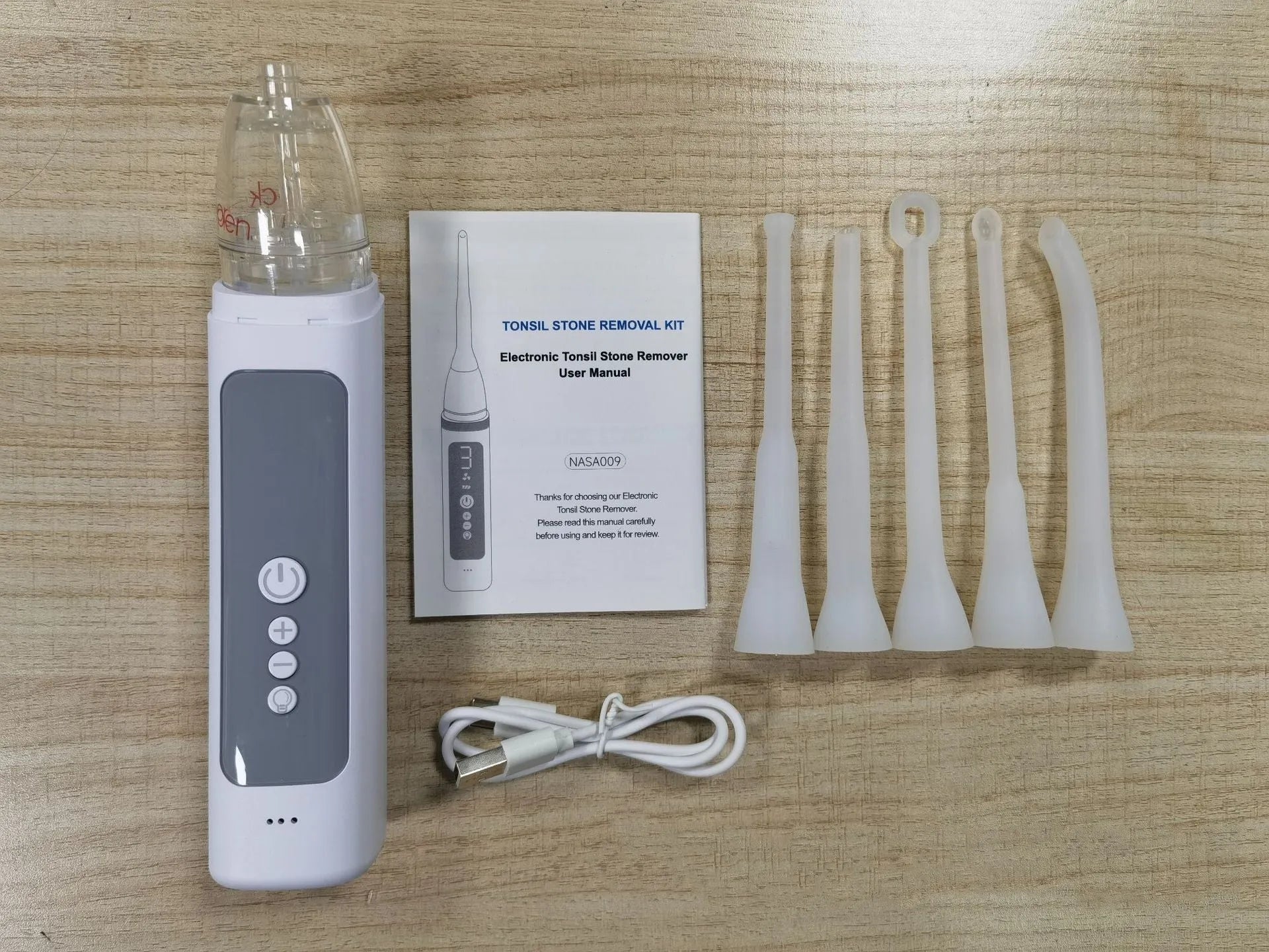 Milky white tonsillar extractor oral cleaning tool for dental stone removal