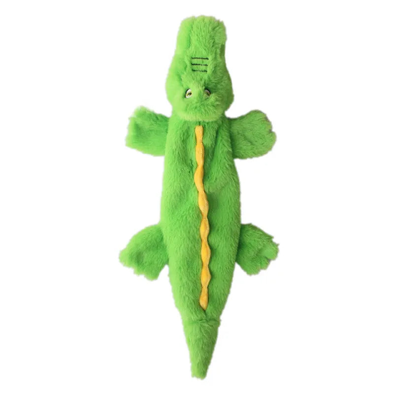 Green crocodile-shaped plush dog toy with no stuffing, squeaker in head, and crinkle paper in tail
