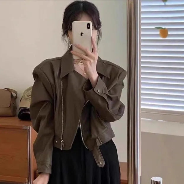 Women's slim fit imitation leather jacket in black with 40cm length and street fashion styling