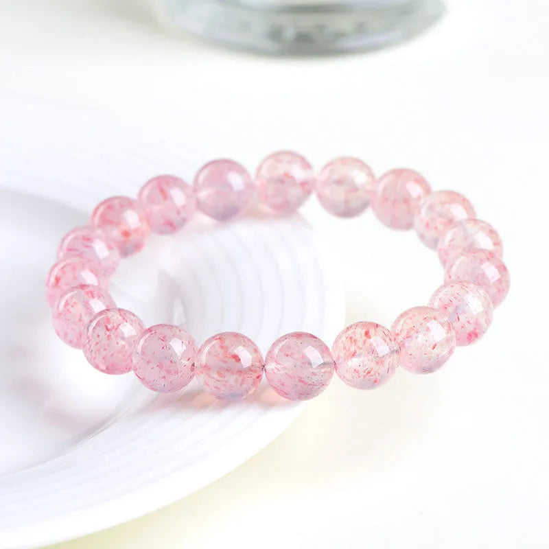 Strawberry quartz crystal bracelet with 10mm polished beads on elastic string