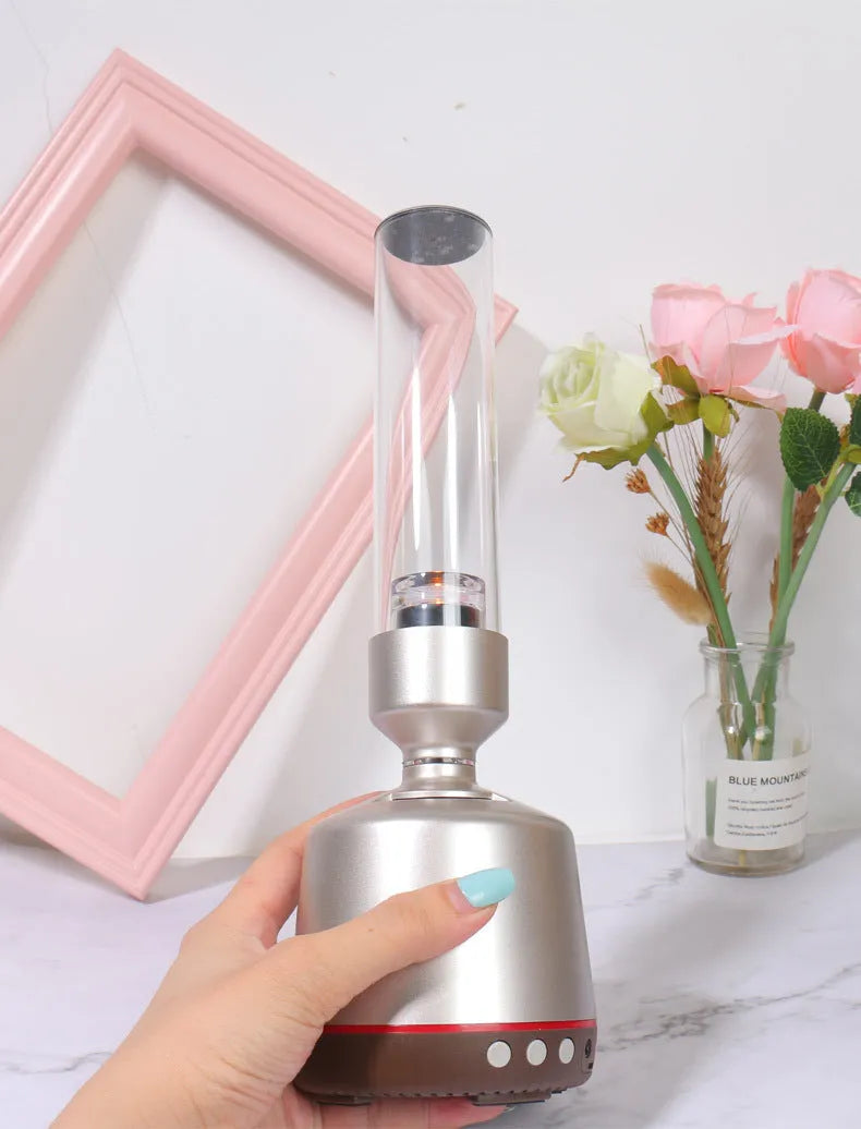 White silver candlelight Bluetooth speaker and LED atmosphere light on a table.