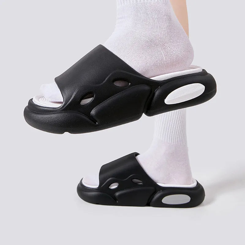 Two-colour EVA foam couple slippers with thick soles and leather lining in black white combination