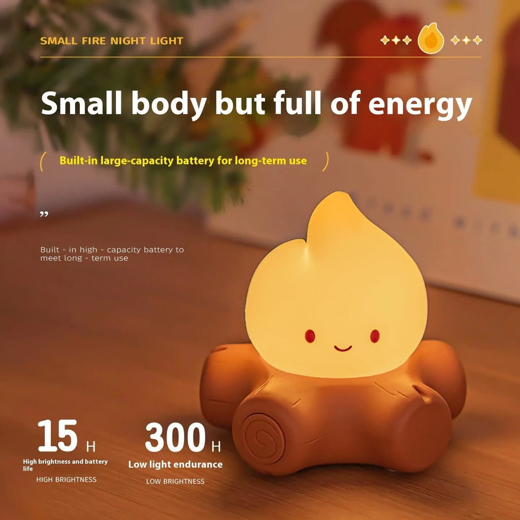 Small cartoon-style night lamp with silicone flame simulation on a table