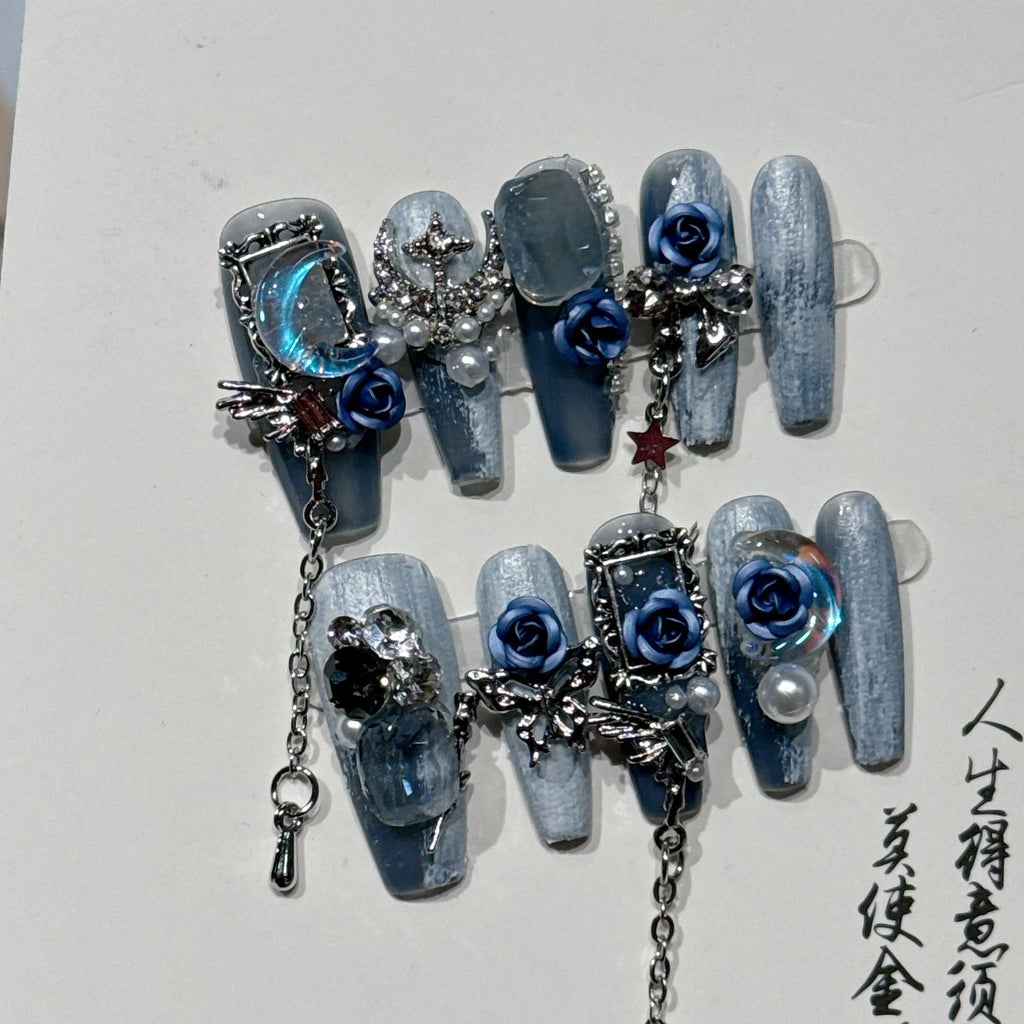 Evening manicure set in heavy industry night blue with rose, tulip, and flower patterns on plastic armour suit