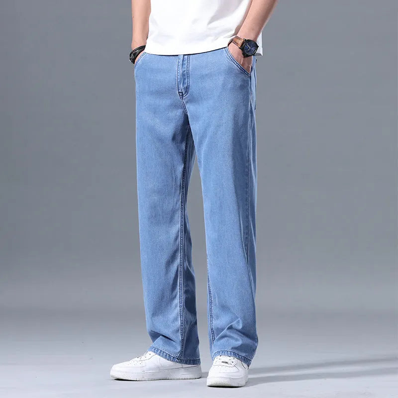 Men's loose straight leg jeans in lyocell blend fabric showing light blue colour option