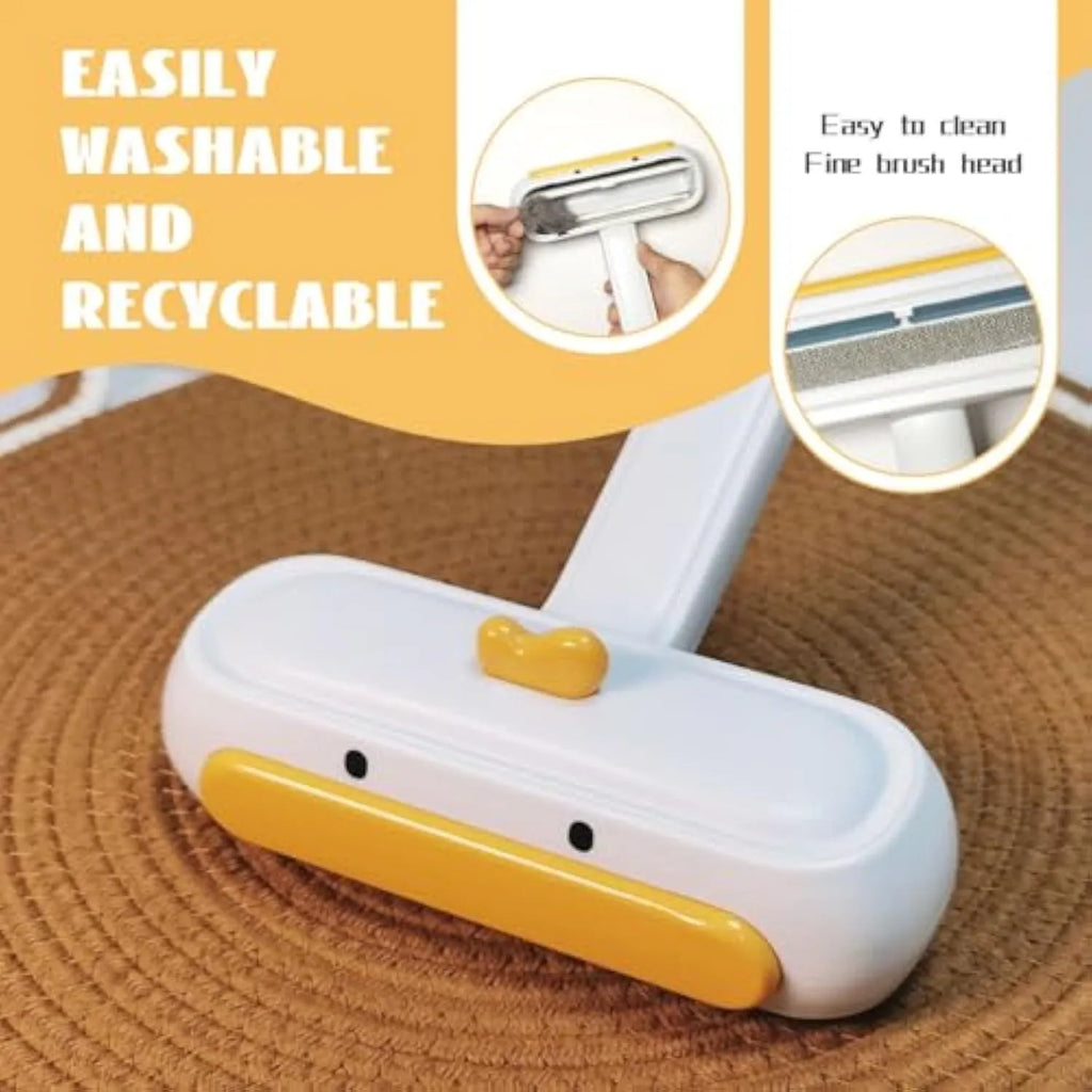 Yellow duck design portable pet hair remover brush with plastic handle and polyester bristles.