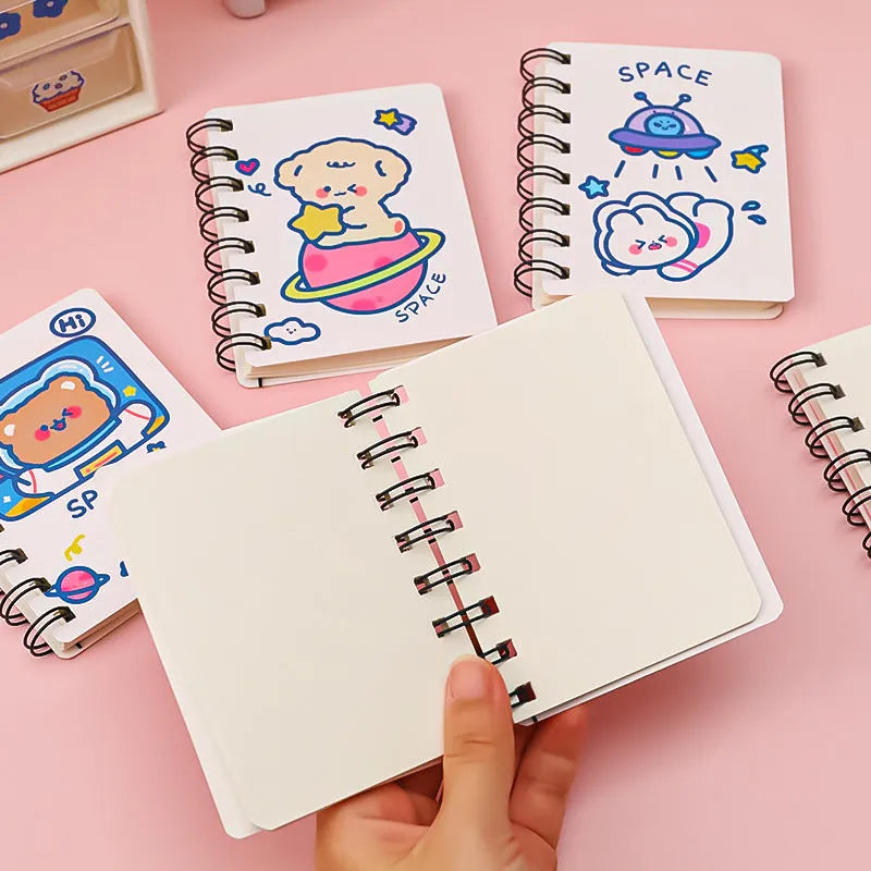 Astronaut pocket flipper notebook showing 10.5x8cm size with space-themed cover designs
