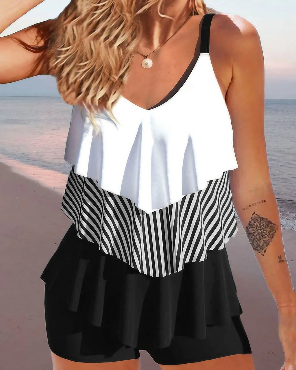 Women's sleeveless backless spaghetti-strap bikini with ruffle detail in various colours and patterns