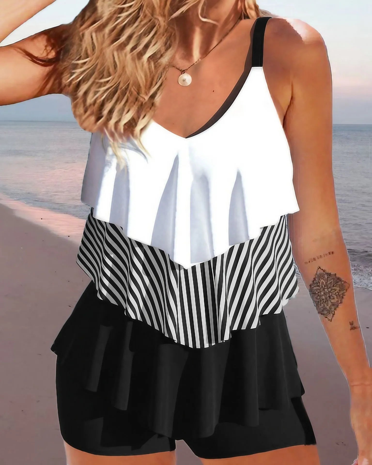 Women's sleeveless backless spaghetti-strap bikini with ruffle detail in various colours and patterns