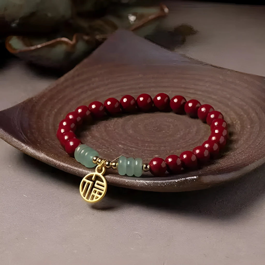 Close-up of a handcrafted wave-shaped cinnabar and copper bead bracelet in national style.