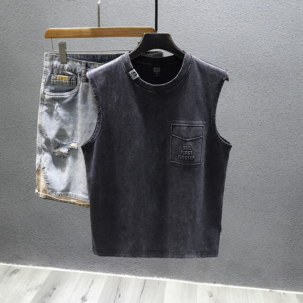 A man's solid black loose-fit cotton sleeveless T-shirt with a straight hem, laid flat.