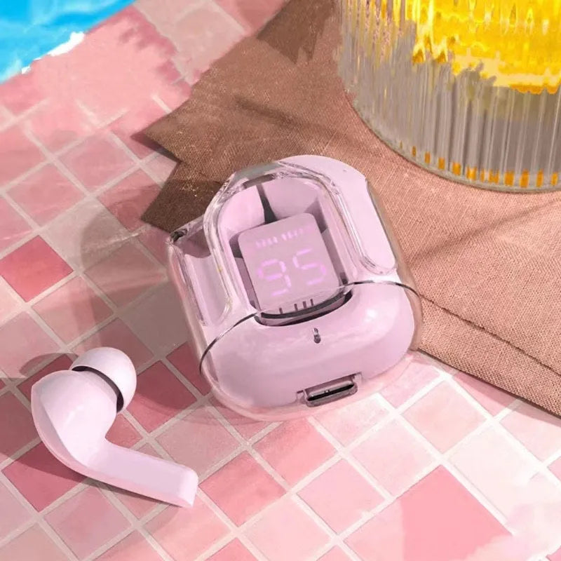 Transparent space capsule case containing true wireless Bluetooth headphones with a digital display screen.