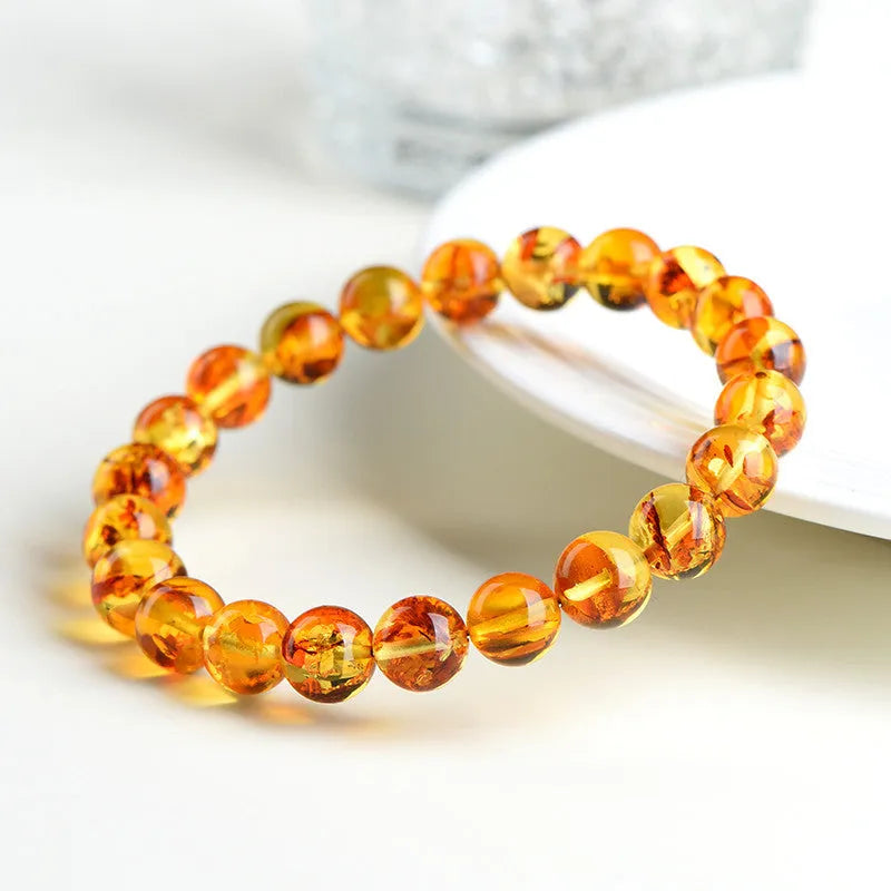 Natural yellow piebald amber bracelet with geometric beads for water purification