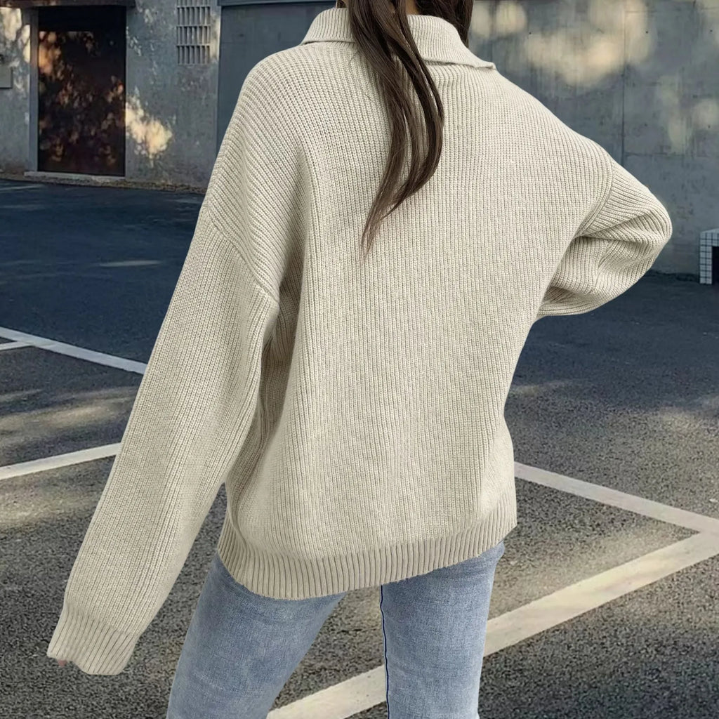 Women's light khaki alpaca fleece sweater with a turtleneck collar and diagonal front zip.