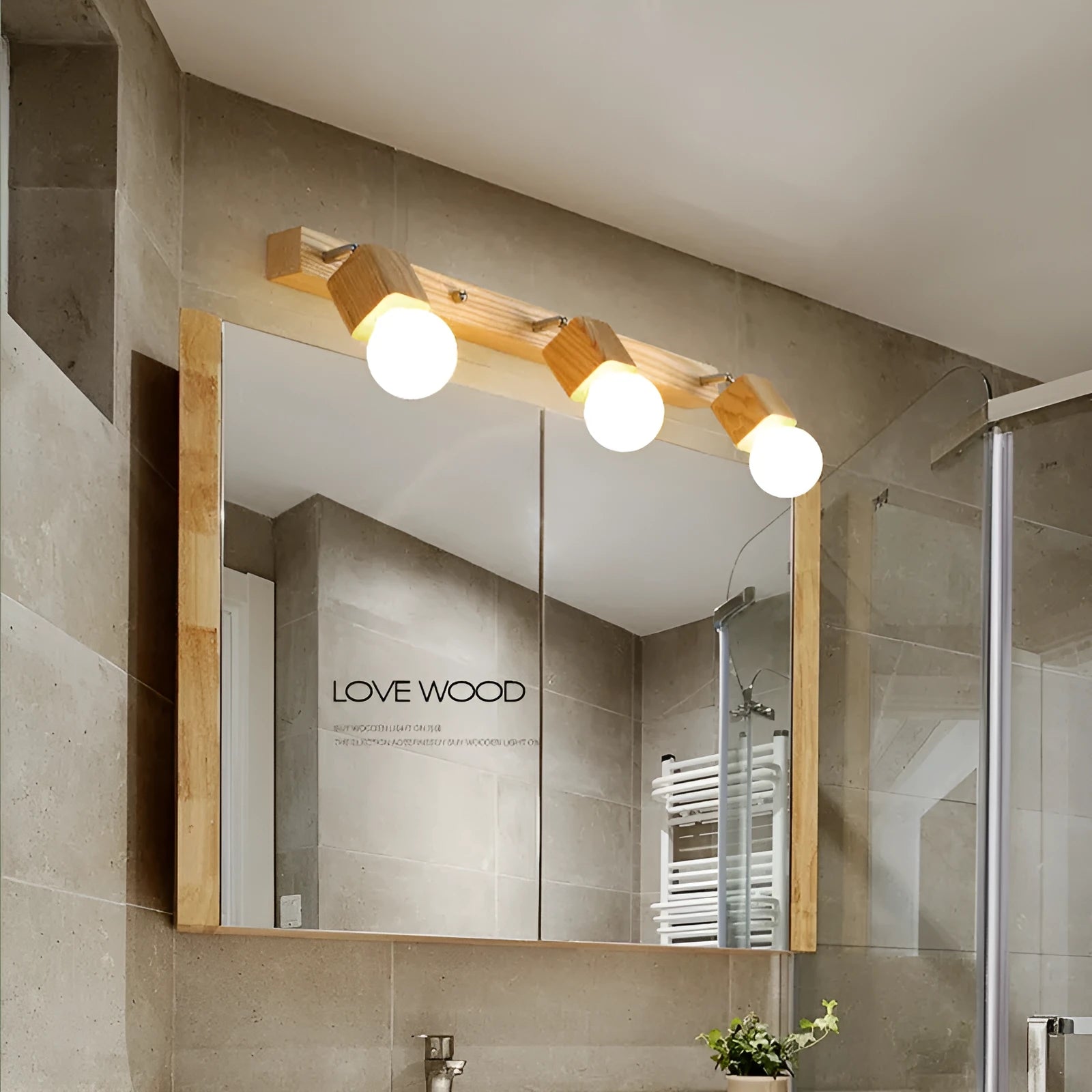 Single-headed 24cm wide LED mirror cabinet wall lamp mounted on a wall