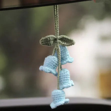 Green and white fish-scale style knitted wool car hanging planter with 8cm base and long white cord.
