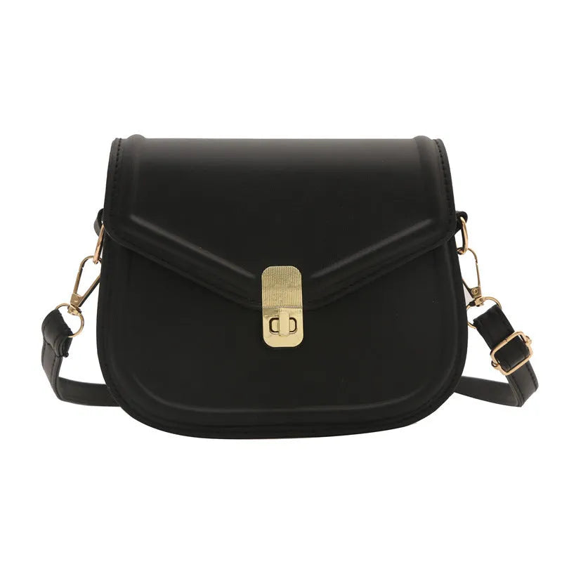 Soft PU leather clamshell messenger bag in a horizontal square shape on a shoulder strap.