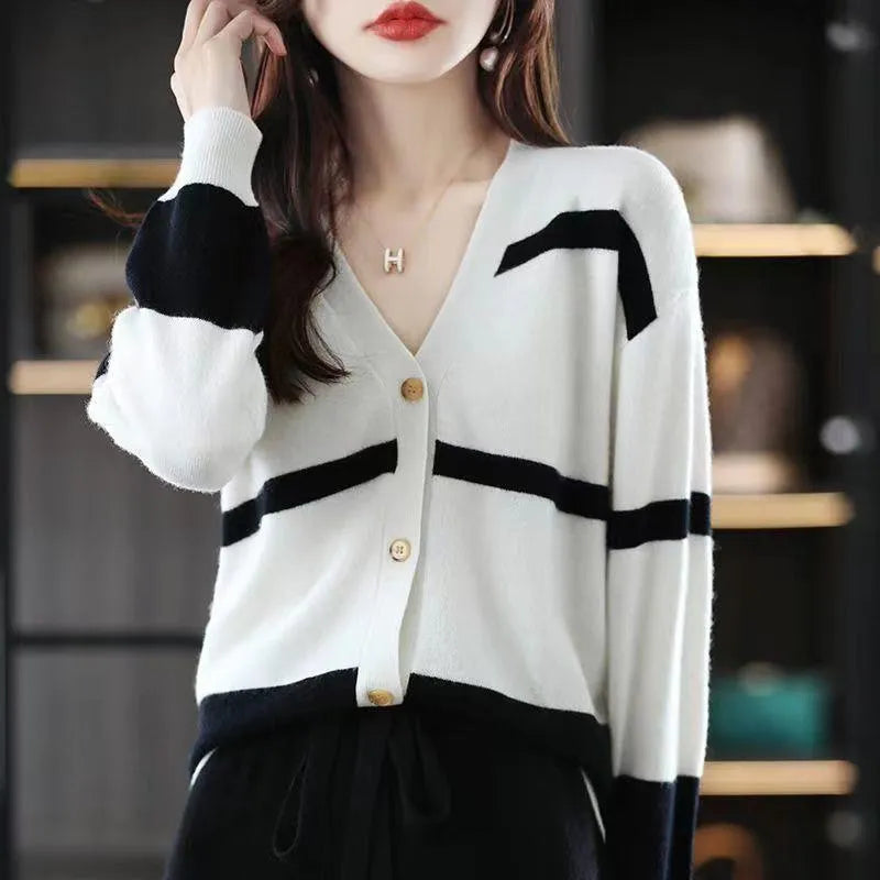 Women's striped V-neck knitted cardigan with 3D pattern in camel colour.