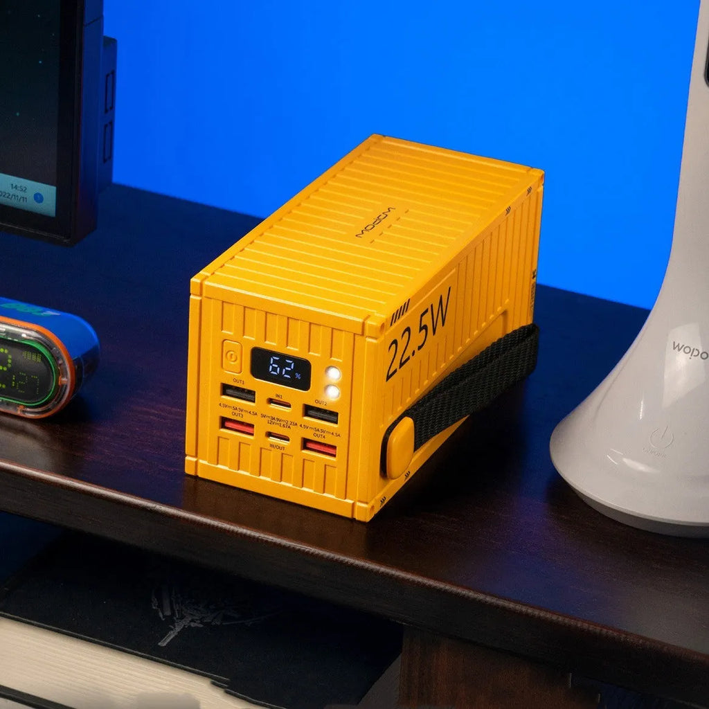 50000mAh yellow black silver plastic power bank with digital display and five USB output ports.