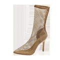 Gold high heel sandals with pointed toe, stiletto heel, mesh upper, and ankle strap.