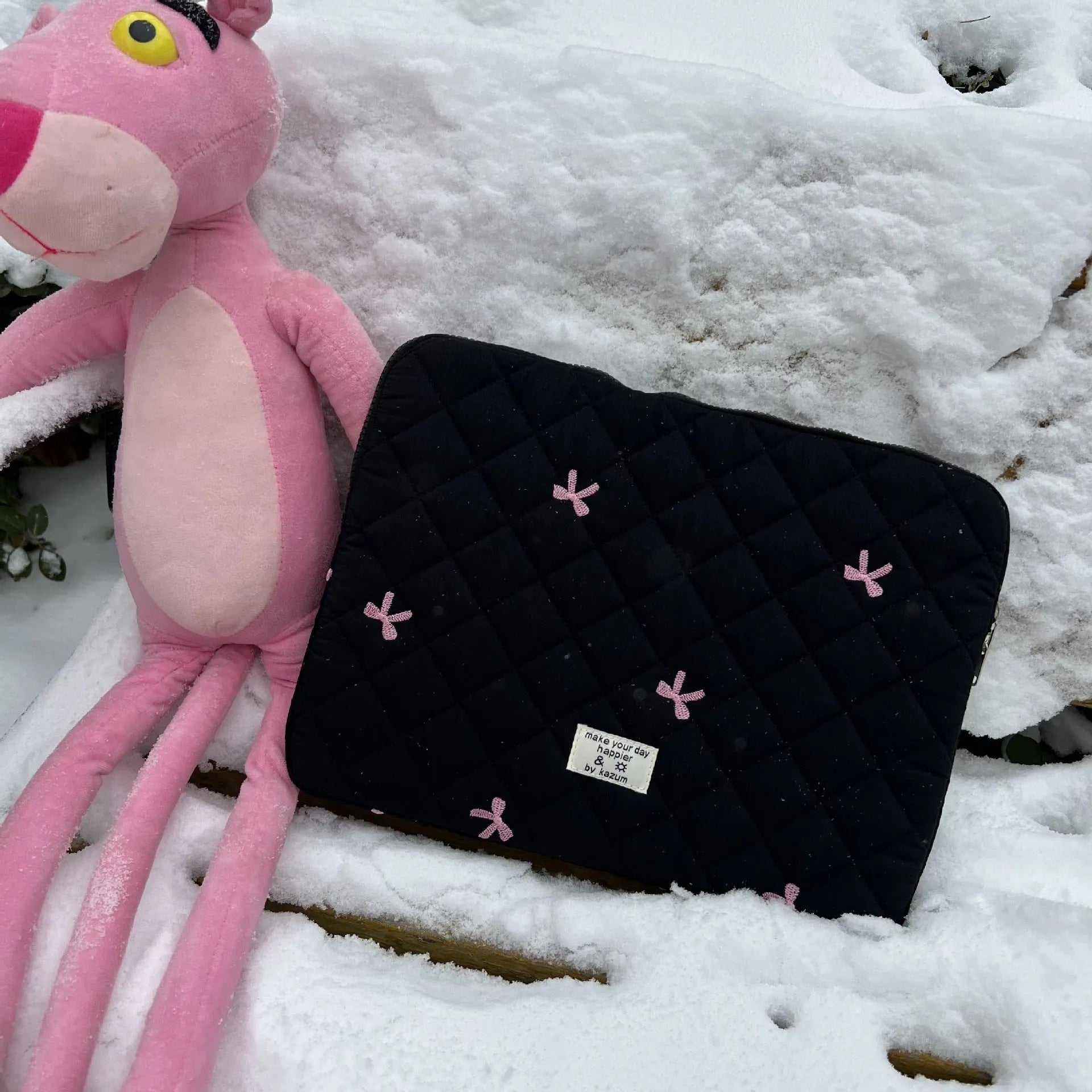 White nylon laptop bag with embroidered rhombus pattern and fabric bow, shown alongside black, light blue, and light pink colour options.