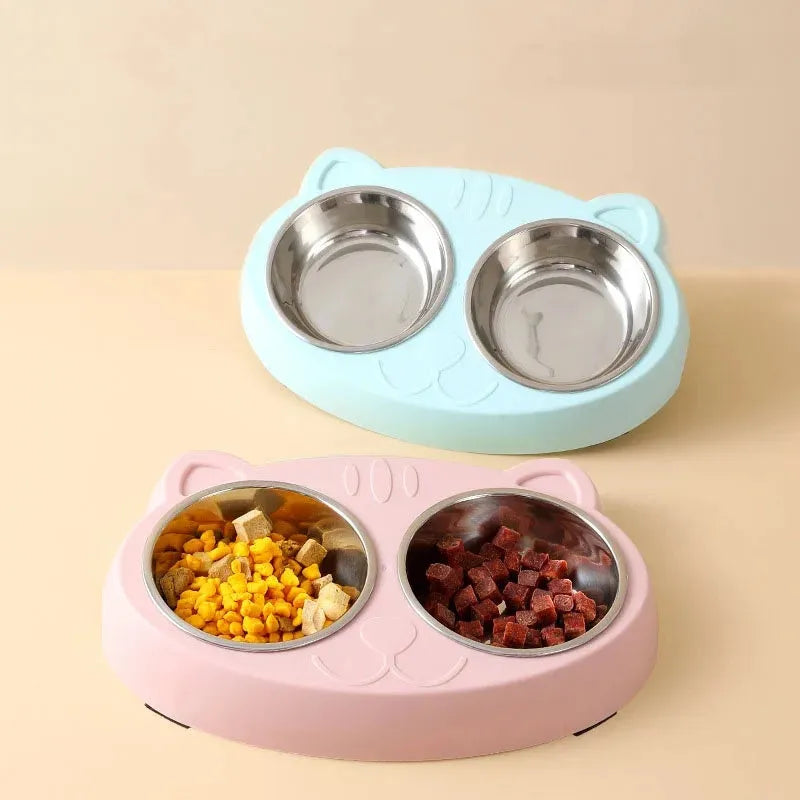 Blue plastic double bowl pet feeder tray with non-slip feet for holding cat or dog food and water dishes.