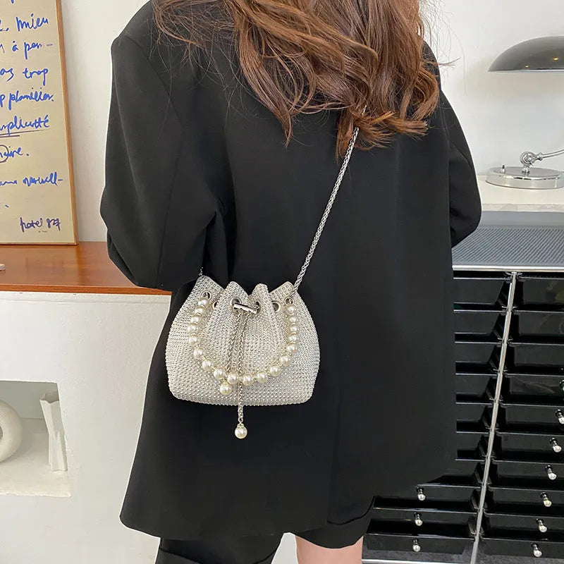 Diamond detailed PU leather crossbody bag with chain strap in bucket shape design